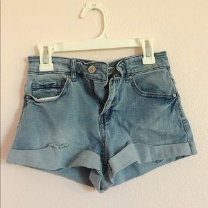 light blue low-wasted denim shorts. no stains